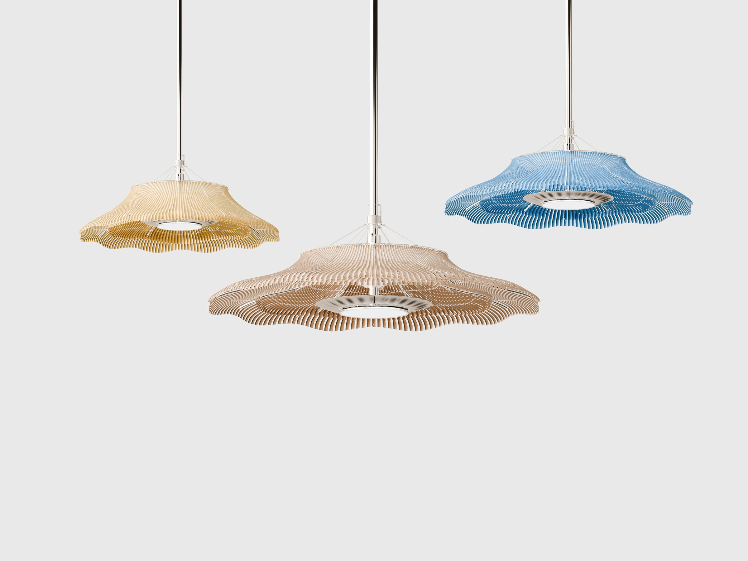 Three Lumen pendants in honey, blush and blue reeds